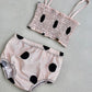 Sleeveless Freckles Top with black dot pattern and matching bottoms.