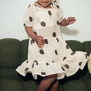 Lightweight polka dot dress with playful charm and timeless elegance