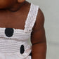 Bubble Oneis in sand color featuring a relaxed fit, gathered leg opening, and snap closures for comfortable wear.
